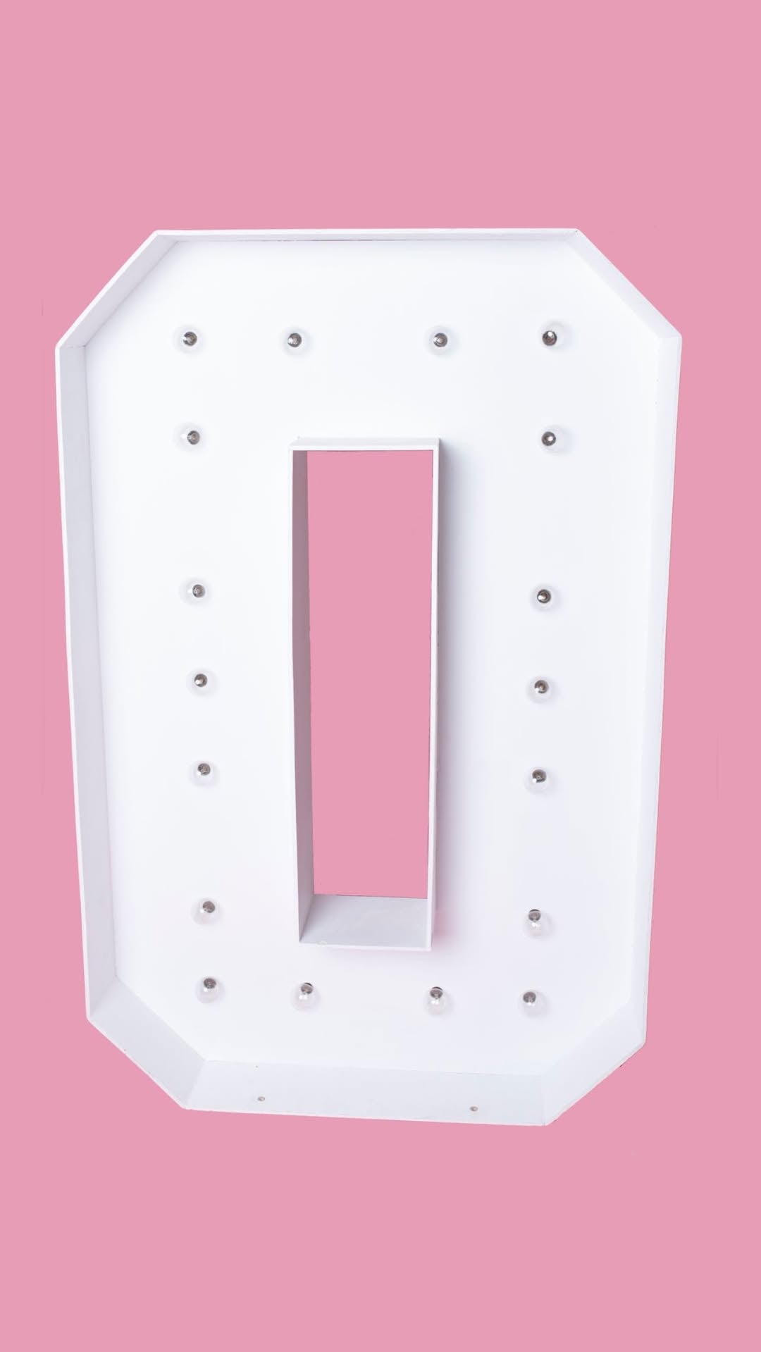 light up number 0 marquee with pink background